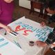 Фото Миргуль Омурзаковой. Плакаты женщина нарисовала сегодня утром вместе с отцом